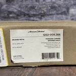 American Standard Passage Corner Shower Shelf In Brushed Metal New. Price: $30.00.