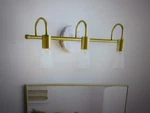 Hampton Bay Hensley 21 In. 3-LIGHT Gold And Faux Marble Bathroom Vanity Open. Price: $29.95.