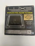 Luxe Stainless Steel Square Tile Drain Open. Price: $20.00.